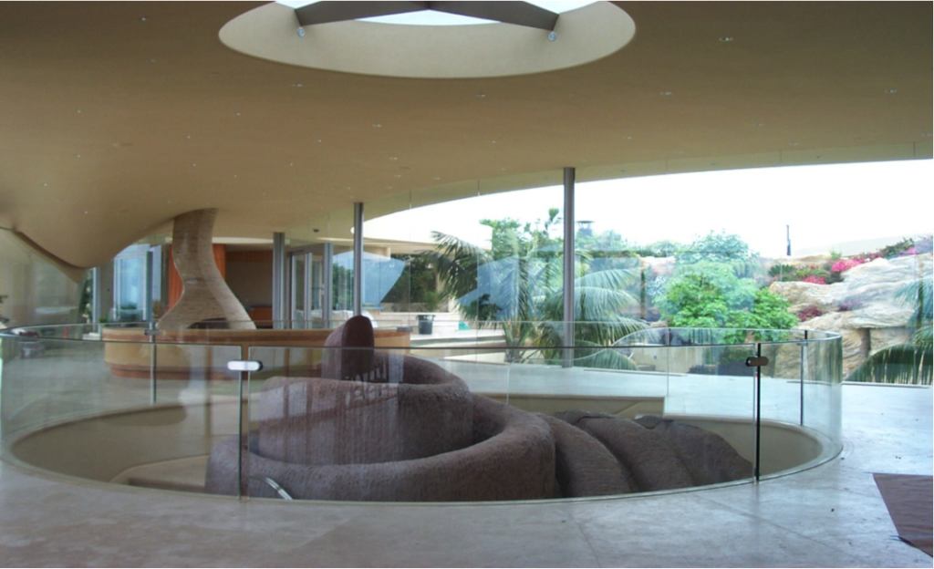 Curved glass railing in a modern residential interior