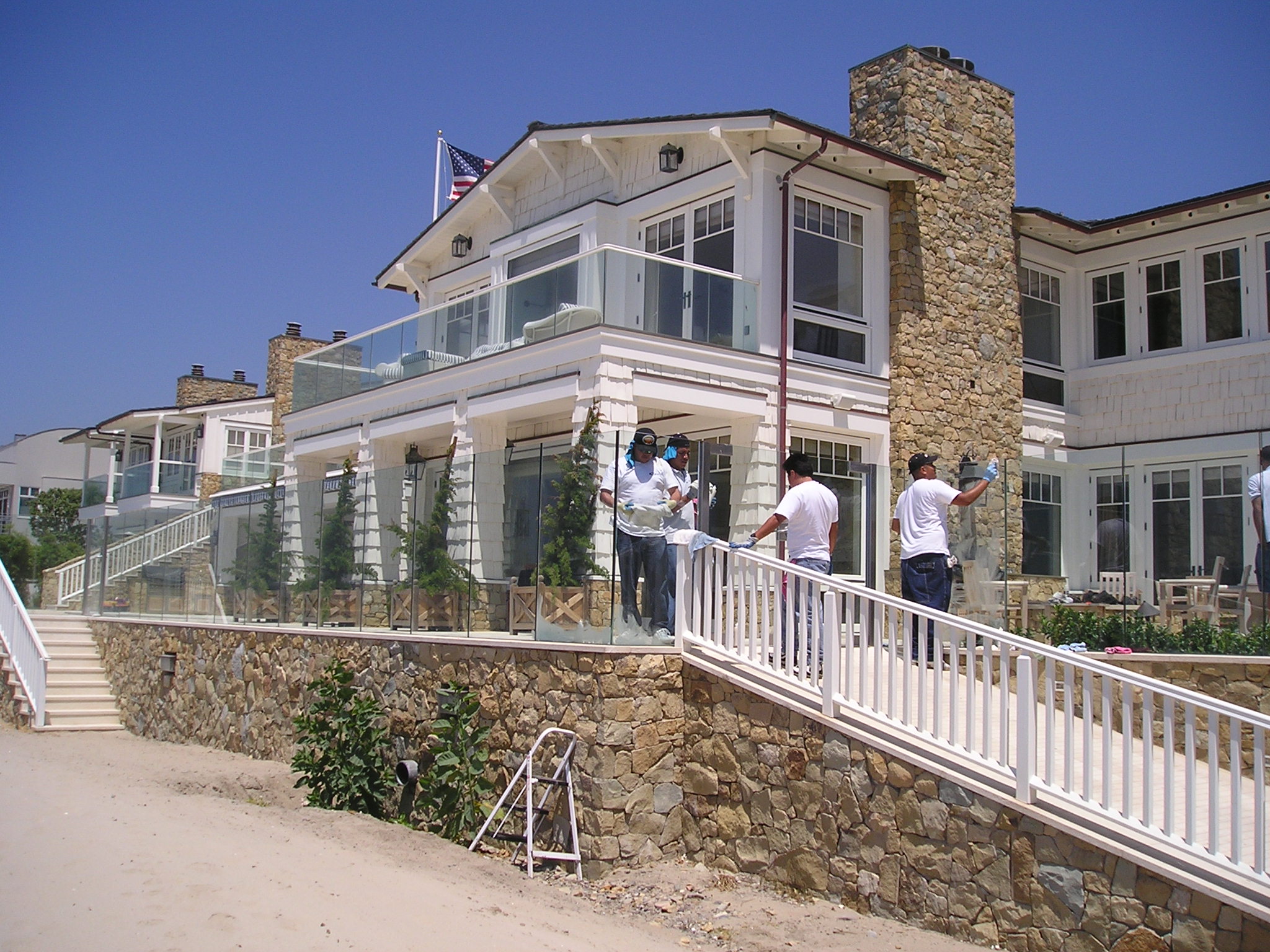 Diamond Seal Systems crew treating exterior glass railings at a Malibu residence