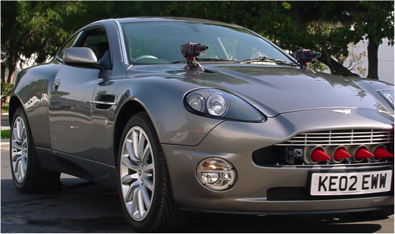 Silver movie car prepared for filming with exterior-mounted cameras