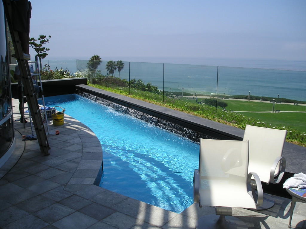 Glass windscreen surrounding a pool at a coastal Malibu residence